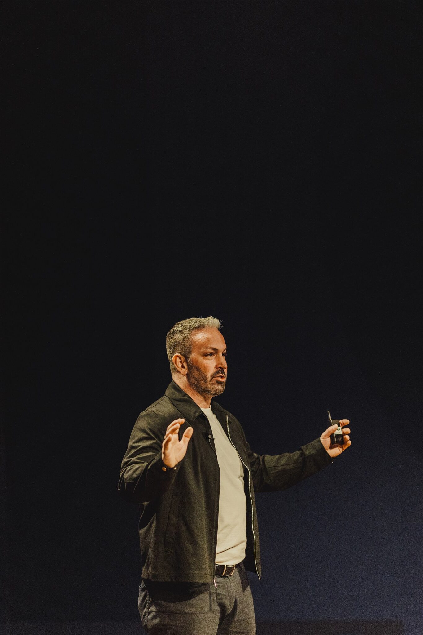 Dr. Alain Desaulniers speaking on stage